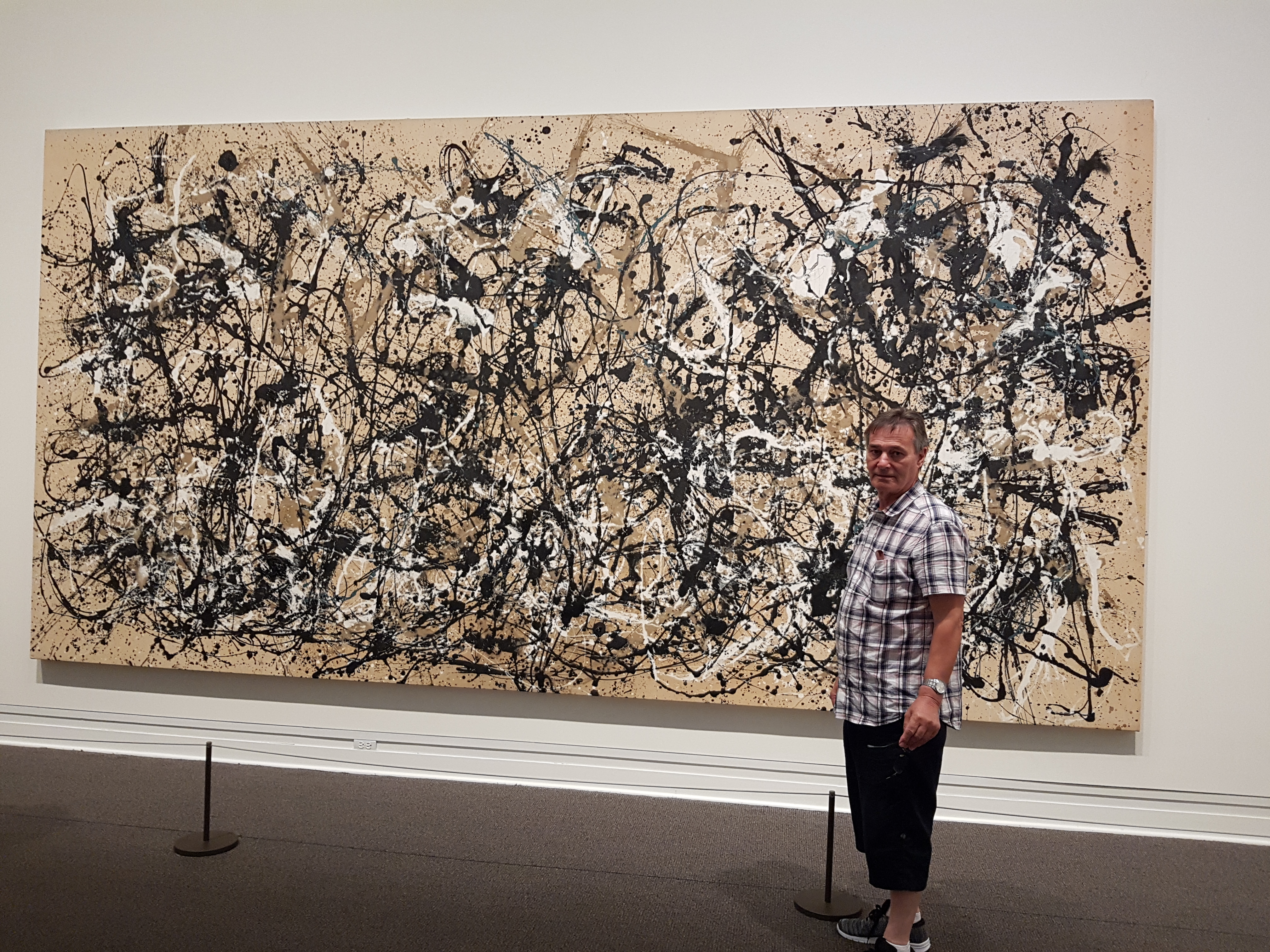 roy munday, artist, in front of a Jackson Pollock painting, new york