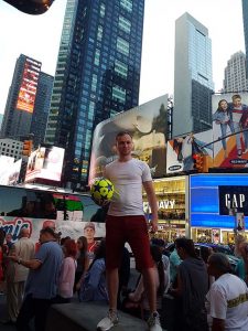 artist roy munday in times square, new york, with son andrew