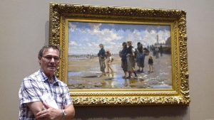 roy munday, artist, painting trip to New York, stood in front of painting by john singer sergeant